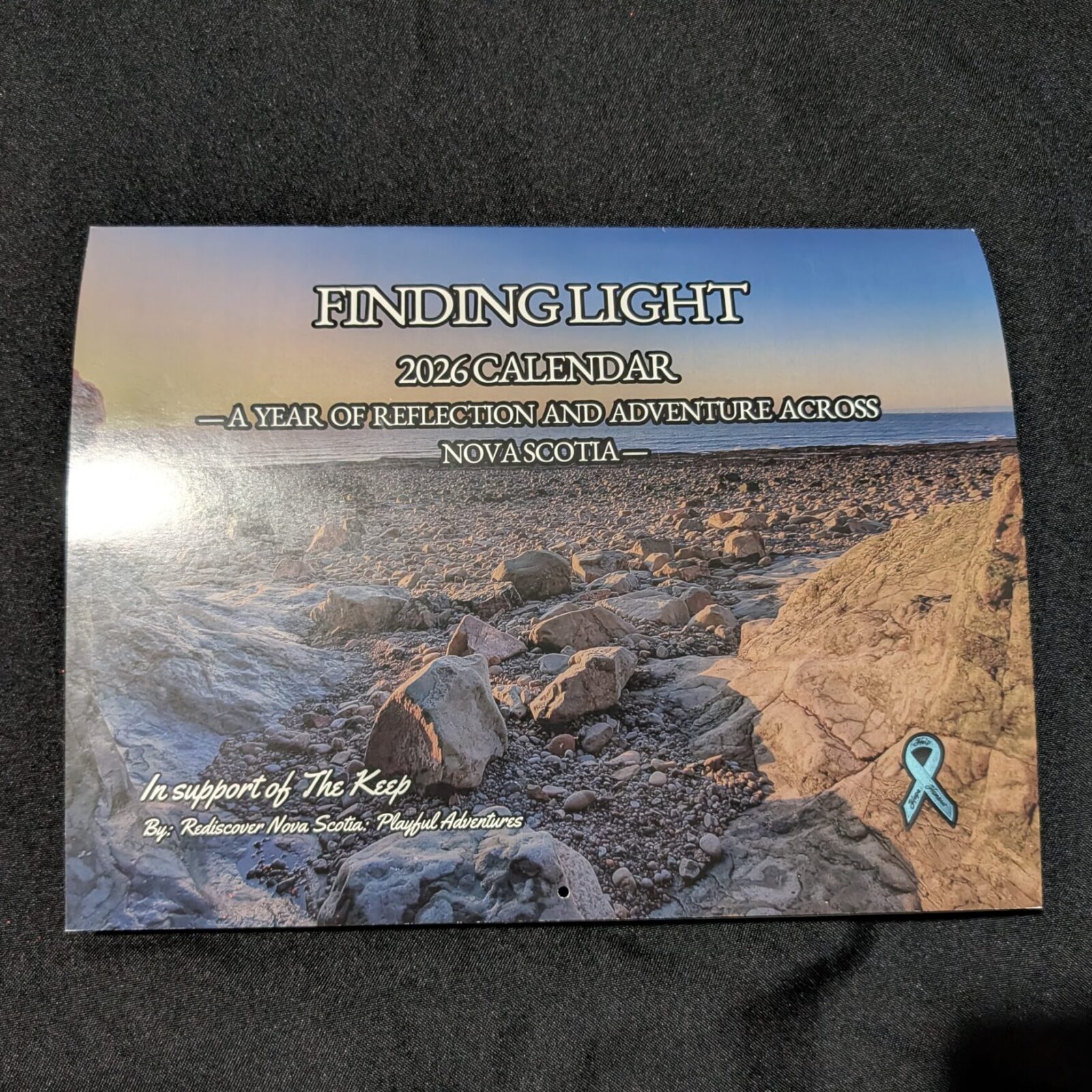 A 2026 wall calendar featuring Nova Scotia landscapes and monthly prompts that inspire reflection and adventure.