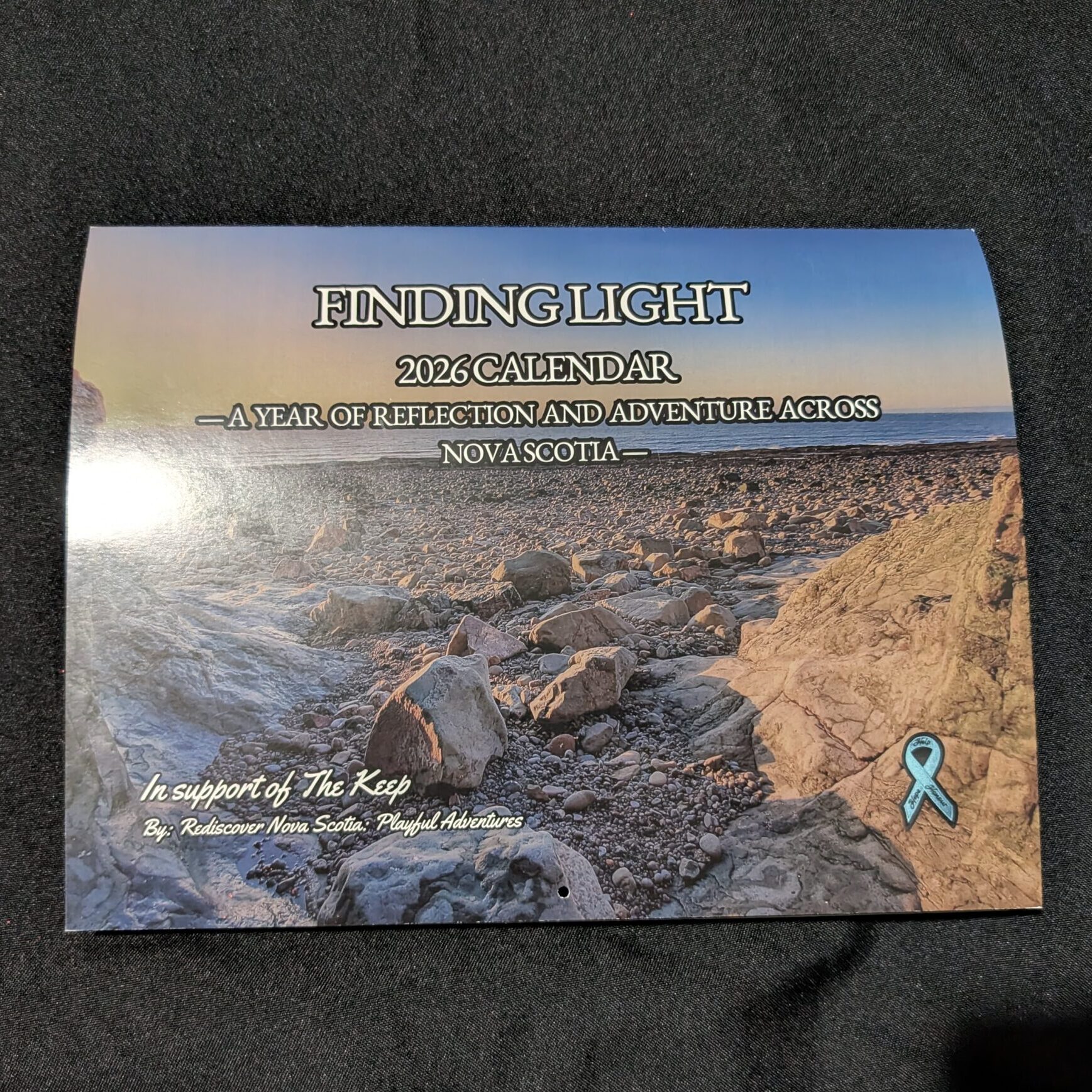 A 2026 wall calendar featuring Nova Scotia landscapes and monthly prompts that inspire reflection and adventure.