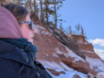 Person admiring the winter coastline along Nova Scotia's Bay of Fundy.
