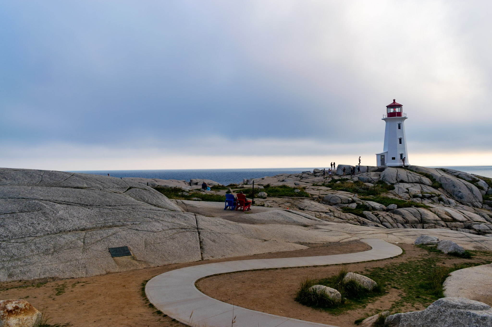 Peggy's Point Lighthouse overlooking the granite rocks and accessible pathway at Peggy's Cove Nova Scotia